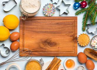 Ingredients for Christmas baking - flour, spices, eggs and cookie cutters.