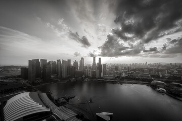 Black and white image of Singapore Skyline and view of skyscrapers on Marina Bay at sunset.