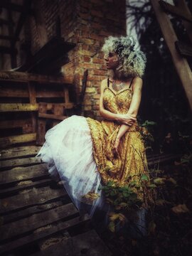 Photo of a woman in an evening dress in a garden