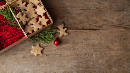 Christmas gifts packed with eco friendly lie on a brown wooden table. zero waste concept