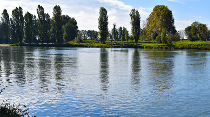 view of a countryside landscape with river and wild nature