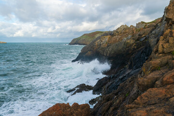Waves crashing on the cliffs