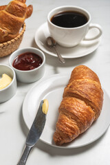 Breakfast with croissant and coffee