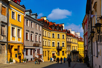 View of traditional colored tenements houses on central streets of Polish city of Lublin in sunny spring day - obrazy, fototapety, plakaty