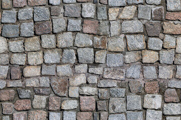 Seamless texture of stone masonry. Background of old stones in the old city.