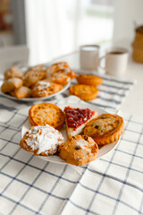 Appetizing rye flour pastries on a table on a linen towel with natural light