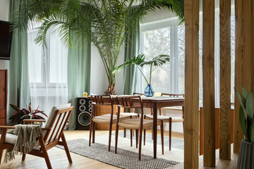 Modern scandinavian home interior of living room with design retro furniture, tropical plant, window, decoration and elegant personal accessoreis in stylish home decor.