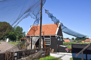 Drying fish traps and a fisherman's cottage in the historic town of Enkhuizen.