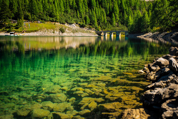 Lake Lago di Livigno in Livigno, Italy. Livigno lake reflection. 