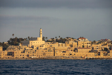 Fototapeta premium View at Old Jaffa buildings from the sea at twilight