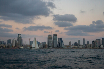 View at Tel Aviv buildings from the sea at twilight
