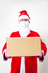 Santa Claus in gloves and face mask deliver package