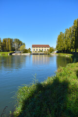Fototapeta premium view of a countryside landscape with river and wild nature