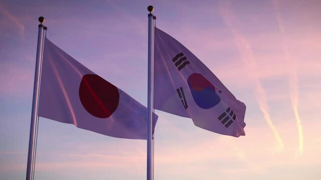 Japan and South Korea flags on a pole showing cooperation between Seoul and Tokyo. International friendship and diplomacy from japanese and koreans.