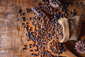 Roasted coffee beans on a wooden spoon