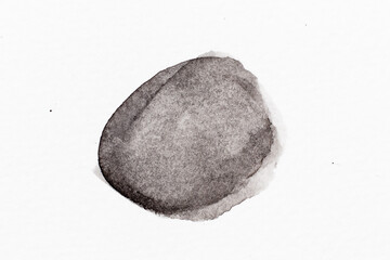 Black color watercolor drawing in round brush or banner shape on white paper background