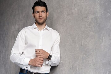 Handsome man wear blue suit isolated on grey background