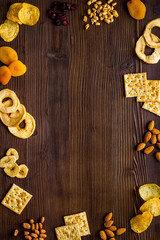 Frame of nuts overhead with dried fruits and other snacks top view
