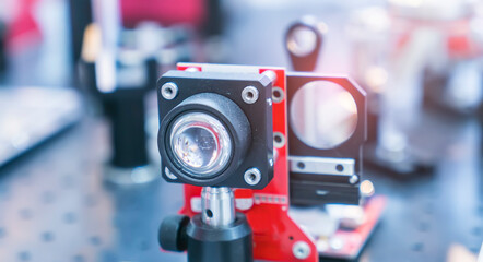 Experiment with laser device in optical laboratory