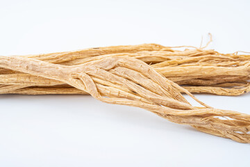 A handful of Chinese herbal medicine Codonopsis on white background