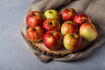 Fresh, juicy apples on a gray background with copy space.