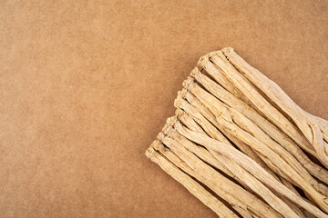 A handful of Chinese herbal medicine Codonopsis on white background