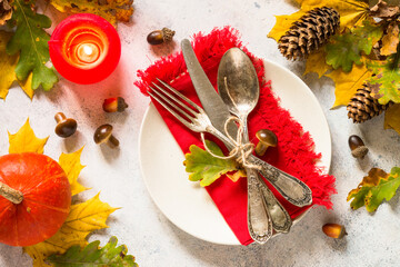 Autumn table setting top view at white table.