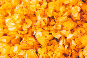 Full frame of delicious french potatoes fries in a rustic style (Selective focus, stylized photo editing)