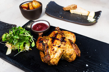 Roasted sleeves chicken with potatoes and barbecue sauce