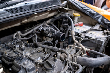 Diesel engine during service, or maintenance at the garage. The internal design of the old engine. Engine car spare part. Explore and check up wear scare of the piston and see deposit at the valve