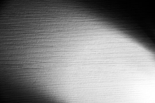 wood texture illuminated by hard light at an angle.
