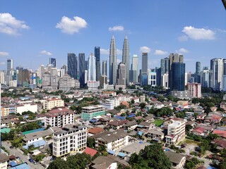 Fototapeta na wymiar Kuala Lumpur, Malaysia - July 21, 2020: View of Kuala Lumpur skyline during sunny day. noise