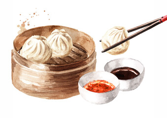 Bamboo steamer and traditional chinese dumplings Dim sum with sauce