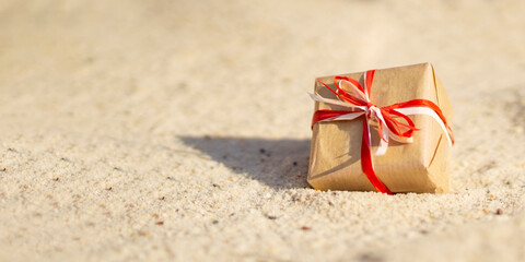 Christmas eco gift on the sand beach