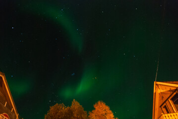 A night sky with beautiful green northern light in Alta, Norway
