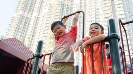 Happy kids are playing together in the park.Healthy children are at the playground during summer...