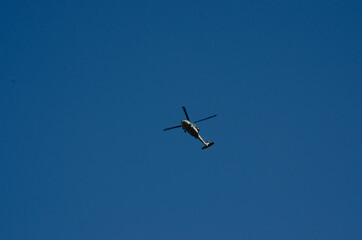 helicopter flying on blue sky