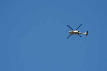 helicopter flying on blue sky