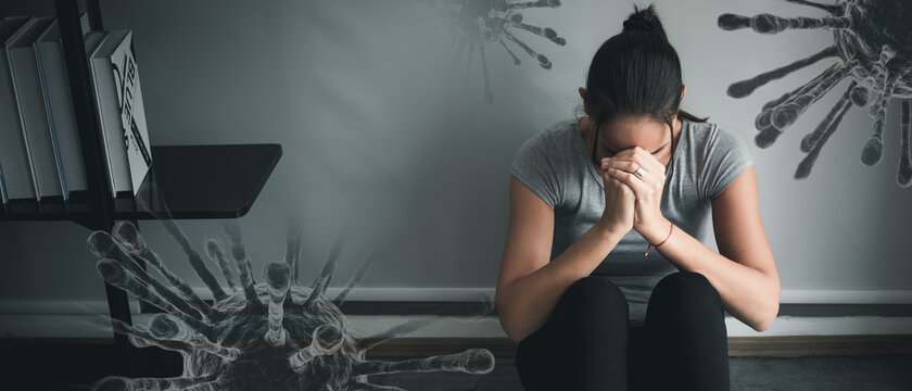 Woman with a mental health illness sitting sad in the room with headache and stress, home quarantine fear of the Coronavirus or COVID-19 outbreak. Double exposure 3D virus background copy space.