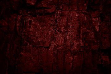 Toned rock texture. Black red stone background. Detail. Dark colored grunge background.