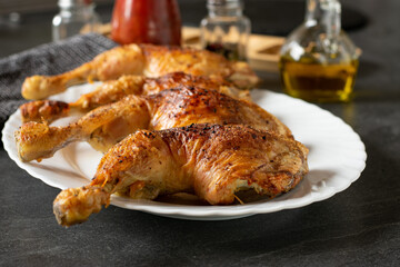 grilled chicken legs with crunchy skin on a plate