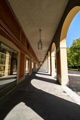 Fototapeta na wymiar Promenade with long arcade columns surrounding Hofgarten Park in Munich, Germany