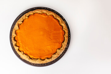 Pumpkin homemade cake on white background with open space without decorations