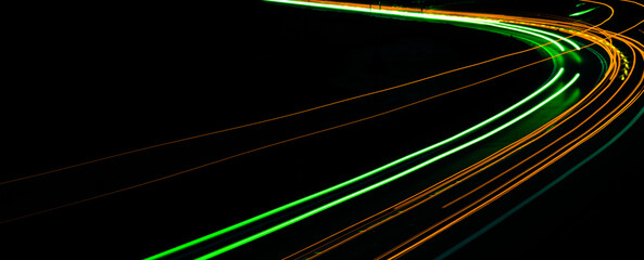 orange car lights at night. long exposure