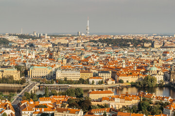 Fototapeta premium Aerial postcard view of Prague,Czechia. Prague panorama.Beautiful sunny landscape of the capital of Czechia.Amazing European cityscape.Red roofs,bridges over Vltava river,TV tower.Travel scenery.