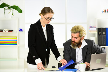 Business couple working. Couple in office. Distribute obligations and organize work team. Boss...