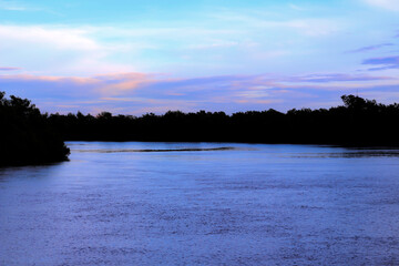 Silhouette river  on the blue sky background