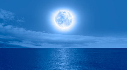 Naklejka na ściany i meble Night sky with blue moon in the clouds 