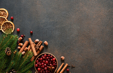Christmas decoration with punch ingredients: cranberry, cinnamon and spices.