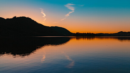 Beautiful alpine sunset view with reflections at the famous Schliersee, Bavaria, Germany